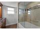 Bathroom with tub shower combo and glass enclosure at 5200 Brittany S Dr # 4-1102, St Petersburg, FL 33715