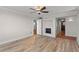 Primary bedroom with hardwood floors and fireplace at 5200 Brittany S Dr # 4-1102, St Petersburg, FL 33715