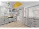 Kitchen with white cabinets, and breakfast bar at 5200 Brittany S Dr # 4-1102, St Petersburg, FL 33715
