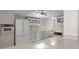 Kitchen with white cabinets and built-in appliances at 5200 Brittany S Dr # 4-1102, St Petersburg, FL 33715