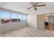 Bright bedroom with water view and wood-look floors at 5200 Brittany S Dr # 4-1102, St Petersburg, FL 33715