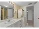 Bathroom features updated vanity and a stackable washer/dryer at 5200 Brittany S Dr # 4-1102, St Petersburg, FL 33715