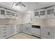 White kitchen with ample cabinet space and appliances at 5200 Brittany S Dr # 4-1102, St Petersburg, FL 33715