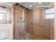 Large walk-in shower with glass enclosure and tile surround at 5200 Brittany S Dr # 4-1102, St Petersburg, FL 33715