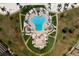 Aerial view of resort-style pool with surrounding lounge chairs and landscaping at 5200 Brittany S Dr # 4-1102, St Petersburg, FL 33715