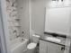 Clean bathroom with marble tile and modern vanity at 211 Dolphin Pt # 201, Clearwater, FL 33767