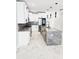 Spacious kitchen featuring a large island and marble flooring at 211 Dolphin Pt # 201, Clearwater, FL 33767