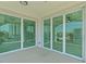 Private balcony with glass doors and water views at 211 Dolphin Pt # 201, Clearwater, FL 33767
