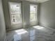 Spacious bedroom with large windows and marble floors at 211 Dolphin Pt # 201, Clearwater, FL 33767