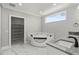 Modern bathroom with corner jacuzzi tub and double vanity at 211 Dolphin Pt # 201, Clearwater, FL 33767