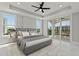 Main bedroom with private balcony and marble floors at 211 Dolphin Pt # 201, Clearwater, FL 33767