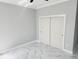 Bright bedroom with double door closet and marble floors at 211 Dolphin Pt # 201, Clearwater, FL 33767