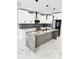 Modern kitchen with marble countertops and stainless steel appliances at 211 Dolphin Pt # 201, Clearwater, FL 33767