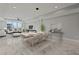 Elegant dining room with modern chandelier and marble floors at 211 Dolphin Pt # 201, Clearwater, FL 33767