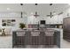 Modern kitchen with large island and pendant lighting at 211 Dolphin Pt # 201, Clearwater, FL 33767