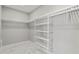 Spacious walk-in closet with ample shelving and hanging space at 211 Dolphin Pt # 302, Clearwater, FL 33767