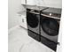 Modern laundry room with Samsung washer and dryer at 211 Dolphin Pt # 302, Clearwater, FL 33767