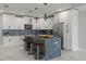 Modern kitchen with white cabinetry, large island, and high-end appliances at 211 Dolphin Pt # 302, Clearwater, FL 33767