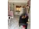 Small living room with black couch, kitchen, and tiled floor at 2154 Bradford St # 205, Clearwater, FL 33760