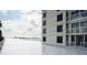 Building exterior with water and city views in the background at 100 Pierce St # 307, Clearwater, FL 33756