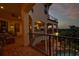 Multi-level outdoor balcony with brick flooring overlooks the pool and trees at 109 Wateredge Ct, Safety Harbor, FL 34695