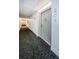 Clean hallway with carpet and access to unit 203 at 400 Island Way # 203, Clearwater, FL 33767