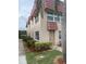 Exterior view of a condo building with red tile roofing at 10033 64Th N Ave # 1, St Petersburg, FL 33708