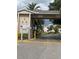 Gated community entrance with signage for Long Bayou Shores at 10033 64Th N Ave # 1, St Petersburg, FL 33708