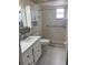 Bathroom with walk-in shower, grab bars, and vanity at 10033 64Th N Ave # 1, St Petersburg, FL 33708