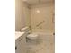 Bathroom with bathtub, vanity, and marble-look flooring at 10033 64Th N Ave # 1, St Petersburg, FL 33708