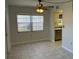 Dining area with tile floor, ceiling fan and kitchen access at 10033 64Th N Ave # 1, St Petersburg, FL 33708