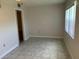 Empty spare bedroom with tile floors and large window at 10033 64Th N Ave # 1, St Petersburg, FL 33708
