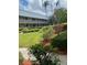 Condo building with lush green landscaping and walkways at 10033 64Th N Ave # 1, St Petersburg, FL 33708