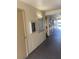 Building hallway with mailboxes and access doors at 10033 64Th N Ave # 1, St Petersburg, FL 33708