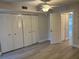 Spacious bedroom with ample closet space and wood-look flooring at 10033 64Th N Ave # 1, St Petersburg, FL 33708