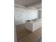 Unfinished kitchen awaiting appliances and countertops, offering a blank canvas for customization at 14048 Gulf Blvd # 402, Madeira Beach, FL 33708