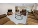 Spacious living room featuring comfortable seating and a view into the dining area at 3423 Eisenhower Dr, Holiday, FL 34691