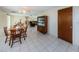 Small dining area with wooden table and chairs, near a hallway at 3423 Eisenhower Dr, Holiday, FL 34691