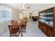 Casual dining area with wood table and chairs, opens to living room at 3423 Eisenhower Dr, Holiday, FL 34691