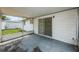 Covered screened porch with sliding glass door access at 3423 Eisenhower Dr, Holiday, FL 34691