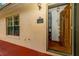 Inviting front entrance with a wooden door and a red porch at 33466 Westwood Dr Dr, Ridge Manor, FL 33523