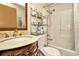 Updated bathroom with a vanity, toilet, shower, and storage shelving at 33466 Westwood Dr Dr, Ridge Manor, FL 33523