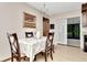 Dining area with hardwood floors, chandelier, and access to back patio at 33466 Westwood Dr Dr, Ridge Manor, FL 33523