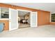 Bright screened porch with view of the dining room and backyard at 33466 Westwood Dr Dr, Ridge Manor, FL 33523