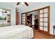 Charming bedroom with double doors that open to the kitchen and living room at 33466 Westwood Dr Dr, Ridge Manor, FL 33523