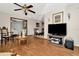 Spacious living room with hardwood floors, ceiling fan and views to dining area at 33466 Westwood Dr Dr, Ridge Manor, FL 33523