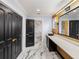 Elegant bathroom with marble floors, a modern vanity, and a large mirror at 2441 69Th S Ave, St Petersburg, FL 33712