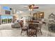 Bright dining area with glass table and four chairs at 5537 Sea Forest Dr # 302, New Port Richey, FL 34652