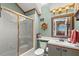 Charming bathroom with a shower/tub combo and nautical decor at 5537 Sea Forest Dr # 302, New Port Richey, FL 34652