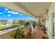 Private balcony with outdoor furniture and lush plants at 5537 Sea Forest Dr # 302, New Port Richey, FL 34652